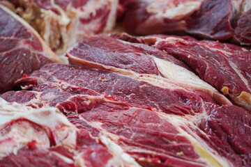 Almaty, Kazakhstan - 03.25.2022 : Different parts of meat are prepared for sale on the open market.