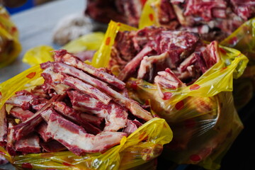 Almaty, Kazakhstan - 03.25.2022 : Different parts of meat are prepared for sale on the open market.