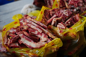Almaty, Kazakhstan - 03.25.2022 : Different parts of meat are prepared for sale on the open market.