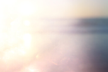 background of blurred beach and sea waves with bokeh lights, vintage filter.