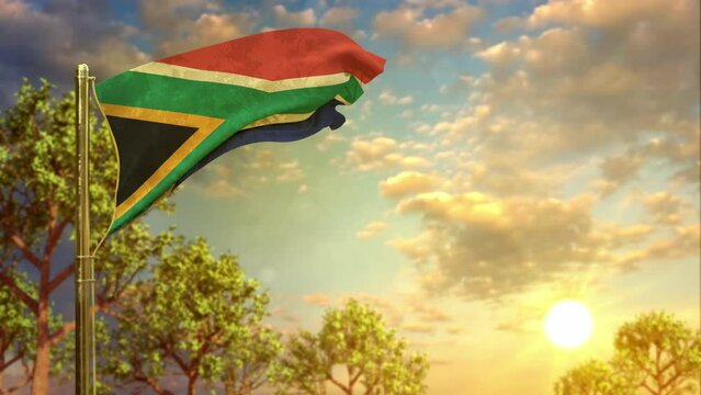 waving flag of South Africa at sunset for national holiday
