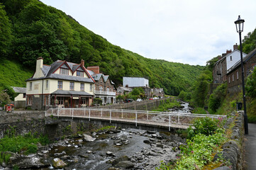 20 May 2022: Lynmouth, Devon, England, UK - A view of the River Lyn and Mars Hill on a sunny day.  Coastal village of Lynmouth in Devon on the northern edge of Exmoor National Park.