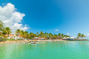 Turquoise water and blue sky in Bas du Fort beach in Guadeloupe
