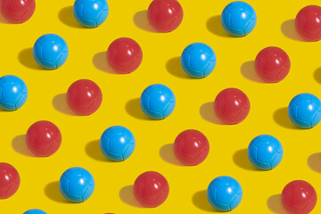 Scheme of plastic red and blue ice cream balls on a yellow background. Ice cream container.