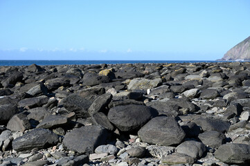 Rocks, stones on the Devon beach during a sunny day