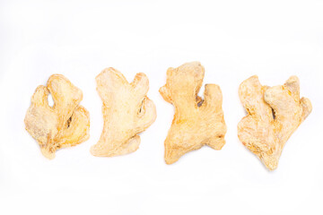 Dried ginger root on white background isolated. Indian spices close up.