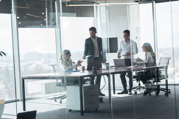 Group of modern,Lawyers, Businesspeople and Investors Gather at the Table in Corporate Meeting Room.