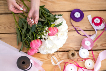 florist creates a bouquet. Flower delivery