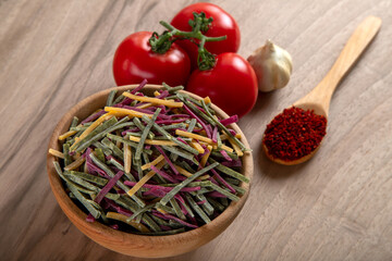 Traditional Turkish colors noodles with tomato, garlic and pepper on wooden background	