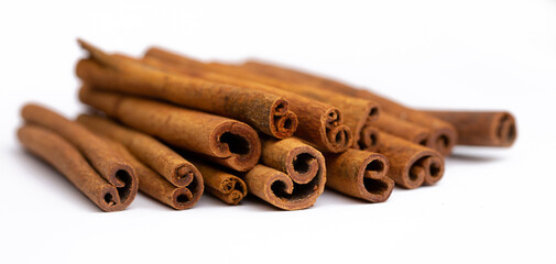 Cinnamon sticks on white background isolated. Indian spices close up. Medicinal herbs and spices.