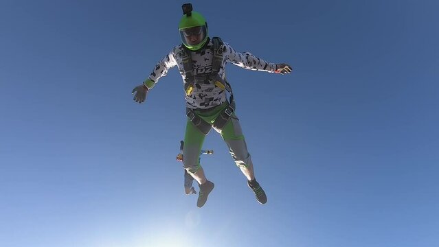 skydiving, acrobatics in the sky, a group of parachutists falling next to each other