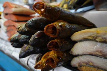 Almaty, Kazakhstan - 03.25.2022 : Selected pieces of fish are put up for sale in an open market.