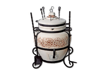 tandoor oven for barbecue and roasting meat made of clay and various drawings with skewers and with a pan with a grill and a cauldron