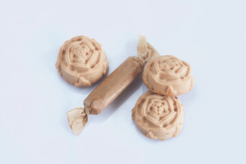 Candy cream toffee. In the form of flowers. Close-up, from above.