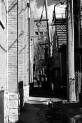 Urban side street in a black and white monochrome.