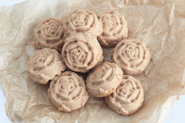 Candy cream toffee. In the form of flowers. Close-up, from above.
