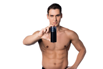 shirtless man with hand on hip showing deodorant isolated on white.