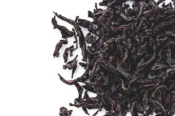 dried black tea on a white acrylic background