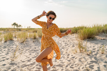 stylish attractive slim smiling woman on beach in summer style fashion trend outfit