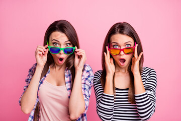 Photo of astonished wondered people arms touch glasses cant believe isolated on pink color background