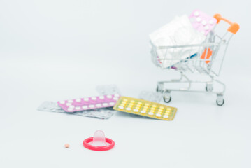 condom with contraceptive, birth control pill, safe sex