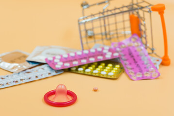 condom with contraceptive, birth control pill, safe sex
