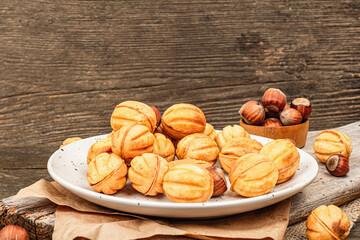 Cookies in the shape of walnuts with condensed milk cream filling.Delicious shortbread sandwiches