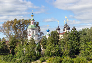 Fototapeta na wymiar Ancient medieval Russian church on the bank of the river