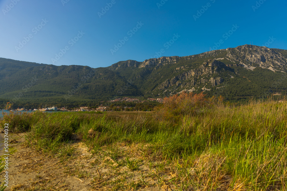 Wall mural akyaka, mugla, turkey: view of akyaka village and mountains on a sunny day