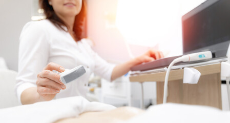 Banner photo, Professional doctor woman use ultrasound scanner device for examining patient female, sunlight