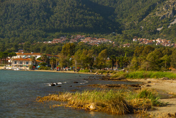 AKYAKA, MUGLA, TURKEY: Landscape with a view of the sea, beach, mountains and the village of Akyaka on a sunny day