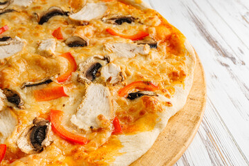 delicious hot traditional italian pizza on a white wooden rustic background