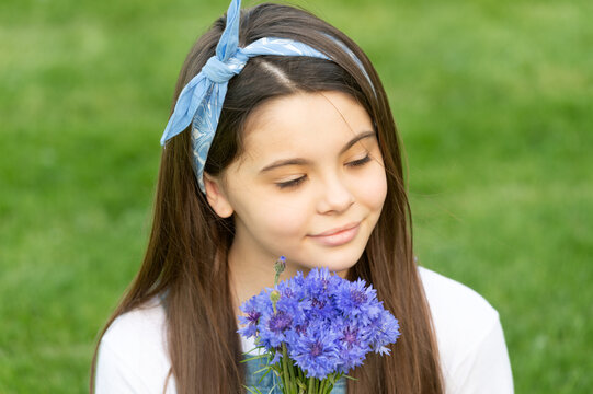 portrait of teen child with spring flowers