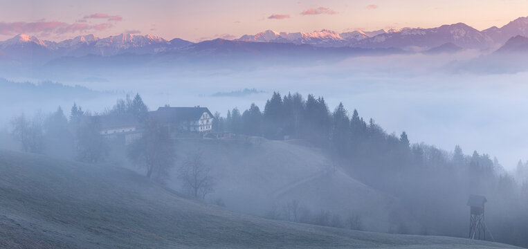 Saint Thomas church on a foggy morning in Slovenia