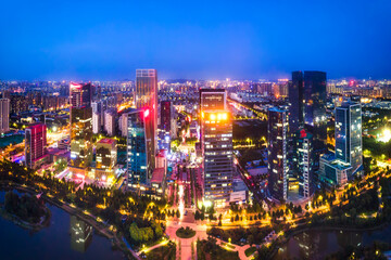 Fototapeta na wymiar Night view of modern urban architecture landscape in Zibo, China