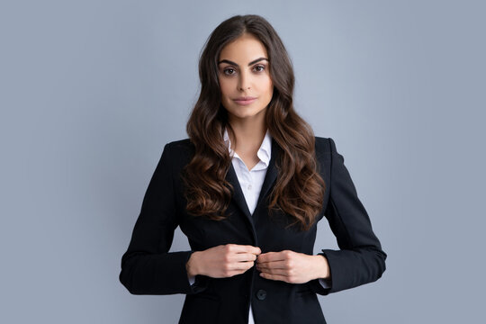 Portrait Of Successful Business Woman In Suit On Gray Isolated Background. Serious Office Female Worker, Manager Employees. Female Employee Young Secretary.