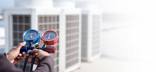 Air conditioner technician checking air conditioner operation