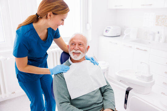 Dentist preparing patient for check up
