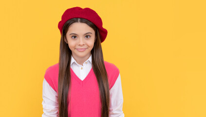 tween and youth concept. casual fashion. happy french teen girl on yellow background.