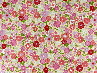 The colorful flowers with leaves pattern on fabric