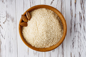 almond flour on a white wooden rustic background