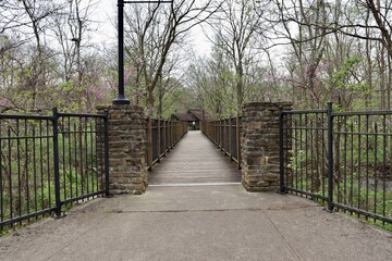 The empty bridge in the park on a spring day.