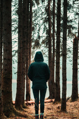 Girl standing in an autumn forest