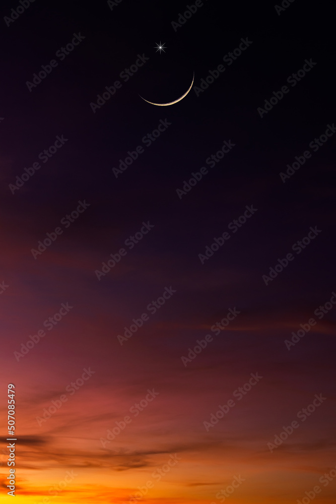 Wall mural crescent moon on dusk sky twilight vertical symbol religion of islamic with free space for text eid 