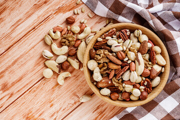 set of different nuts on a wooden rustic background