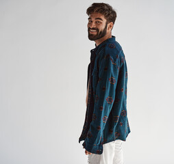 Handsome cheerful man wear flannel shirt and looking at camera isolated on white
