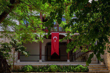 Turkish flag in the garden of the traditional house.