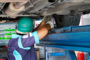 mechanic has checked the camber wheel alignment in the service station,automotive mechanic education concept