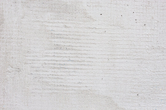 Grey cement plaster on fiber mesh texture