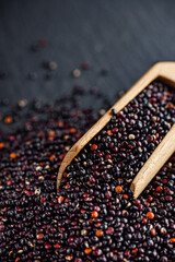 black quinoa seeds on a dark rustic background